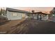 View of the home's back, showcasing a covered patio and landscaping at 4205 E Peak View Rd, Cave Creek, AZ 85331