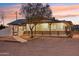 Light-colored house with a long covered porch, dark railings, and walkway at 4205 E Peak View Rd, Cave Creek, AZ 85331