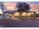 House exterior view at sunset, highlighting architectural details at 4205 E Peak View Rd, Cave Creek, AZ 85331