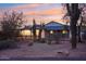 Updated ranch house with covered patio at sunset at 4205 E Peak View Rd, Cave Creek, AZ 85331