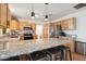 Modern kitchen with light wood cabinets, granite countertops, and stainless steel appliances at 4205 E Peak View Rd, Cave Creek, AZ 85331