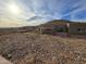 Home's backyard with rocky terrain and distant mountain view at 46312 N 38Th Ave, New River, AZ 85087