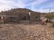 View of the home's backyard, showing a rocky landscape at 46312 N 38Th Ave, New River, AZ 85087