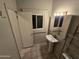 Bathroom with pedestal sink, toilet and shower/tub at 46312 N 38Th Ave, New River, AZ 85087