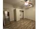 Bright bedroom with ceiling fan, closet, and wood-look floors at 46312 N 38Th Ave, New River, AZ 85087