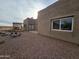 Rear view of stucco home with patio and mountain views at 46312 N 38Th Ave, New River, AZ 85087