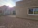 Rear view of stucco home with patio and mountain views at 46312 N 38Th Ave, New River, AZ 85087