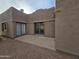 Home's backyard features a spacious patio with sliding glass doors at 46312 N 38Th Ave, New River, AZ 85087