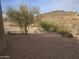 Gravel side yard with desert landscaping and mountain views at 46312 N 38Th Ave, New River, AZ 85087