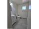 Clean bathroom with white vanity and gray tile floor at 4649 S 17Th St, Phoenix, AZ 85040