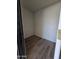 Small laundry room with wood-look floors at 4649 S 17Th St, Phoenix, AZ 85040