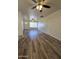 Bright living room featuring wood-look floors and ceiling fan at 4649 S 17Th St, Phoenix, AZ 85040