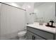 Modern bathroom with gray vanity and white shower at 4802 S Duffy --, Mesa, AZ 85212