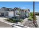 Single-story home with gray siding, white garage door, and small front yard at 4802 S Duffy --, Mesa, AZ 85212