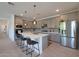 Modern kitchen with gray cabinets, quartz countertops, and stainless steel appliances at 4802 S Duffy --, Mesa, AZ 85212