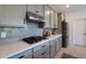 Modern kitchen with gray cabinets, gas cooktop, and white quartz countertops at 4802 S Duffy --, Mesa, AZ 85212