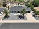 Charming home features palm trees, neutral tones, a concrete driveway and solar panels in a well-maintained neighborhood at 4916 E Kathleen Rd, Scottsdale, AZ 85254