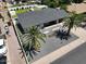 Charming home with palm trees and gray gravel is landscaped with neutral colored rock and bordered by white concrete at 4916 E Kathleen Rd, Scottsdale, AZ 85254