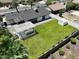 A well-maintained backyard is fully fenced with a white pergola and lush lawn, perfect for outdoor gatherings at 4916 E Kathleen Rd, Scottsdale, AZ 85254