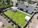 A well-maintained backyard is fully fenced with a white pergola and lush lawn, perfect for outdoor gatherings at 4916 E Kathleen Rd, Scottsdale, AZ 85254