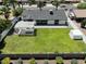 A well-maintained backyard is fully fenced with a white pergola and lush lawn, perfect for outdoor gatherings at 4916 E Kathleen Rd, Scottsdale, AZ 85254