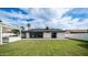 Well-maintained backyard with lush lawn, outdoor kitchen, and desert landscaping at 4916 E Kathleen Rd, Scottsdale, AZ 85254