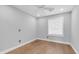 Cozy bedroom with hardwood floors, neutral walls, and a bright window at 4916 E Kathleen Rd, Scottsdale, AZ 85254