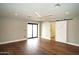 Bedroom with hardwood floors, sliding door, and barn door at 4916 E Kathleen Rd, Scottsdale, AZ 85254