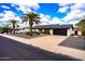 Bright white exterior with black accents and palm trees at 4916 E Kathleen Rd, Scottsdale, AZ 85254