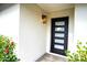 Modern black front door with glass panels at 4916 E Kathleen Rd, Scottsdale, AZ 85254