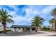 Charming single-story home featuring desert landscaping and a black garage door against a bright blue sky at 4916 E Kathleen Rd, Scottsdale, AZ 85254