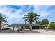 Charming single-story home featuring desert landscaping and a black garage door with a clear blue sky overhead at 4916 E Kathleen Rd, Scottsdale, AZ 85254