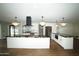 Modern kitchen island with waterfall edge at 4916 E Kathleen Rd, Scottsdale, AZ 85254