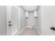 Bright laundry room featuring tiled floors, white cabinets, and utility connections at 4916 E Kathleen Rd, Scottsdale, AZ 85254