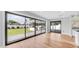 An inviting living room featuring backyard views through sliding glass doors and hardwood flooring at 4916 E Kathleen Rd, Scottsdale, AZ 85254