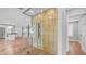 Custom wine cellar with glass enclosure and decorative metal backing at 4916 E Kathleen Rd, Scottsdale, AZ 85254