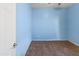 Simple bedroom with light blue walls and brown carpet at 4933 W Melody Ln, Laveen, AZ 85339