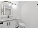 Updated bathroom with white vanity and gray flooring at 5344 W Desert Hills Dr, Glendale, AZ 85304