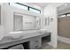 Modern bathroom with double vanity and walk-in shower at 5344 W Desert Hills Dr, Glendale, AZ 85304