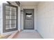 Gray front door with a wood-like design and sidelights at 5344 W Desert Hills Dr, Glendale, AZ 85304