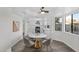 Kitchen with white cabinets, quartz countertops, and gold dining set at 5344 W Desert Hills Dr, Glendale, AZ 85304