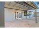 Covered patio with double French doors leading to the house at 5344 W Desert Hills Dr, Glendale, AZ 85304