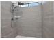 Clean shower with gray tile and a rainfall shower head at 5344 W Desert Hills Dr, Glendale, AZ 85304