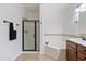 Bathroom with soaking tub, shower, and dark wood vanity at 5350 E Deer Valley Dr # 1418, Phoenix, AZ 85054