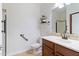 Clean bathroom, featuring a walk-in shower and wood vanity at 5350 E Deer Valley Dr # 1418, Phoenix, AZ 85054