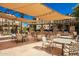 Community patio with tables, chairs, and grills at 5350 E Deer Valley Dr # 1418, Phoenix, AZ 85054