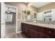 Double vanity bathroom with granite countertop at 5429 E Barwick Dr, Cave Creek, AZ 85331