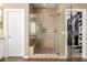 Bathroom with shower, built-in seat, and walk-in closet at 5429 E Barwick Dr, Cave Creek, AZ 85331