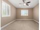 Bright bedroom with ceiling fan and window at 5429 E Barwick Dr, Cave Creek, AZ 85331