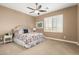 Bedroom with floral bedding, nightstand, and window at 5429 E Barwick Dr, Cave Creek, AZ 85331